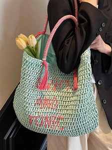 Mint green straw tote bag with SWIM AND TONIC embroidery and pink tassel for summer beach