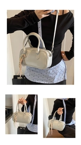 Détails du sac bowling crème avec décoration de nœud tressé et bandoulière amovible