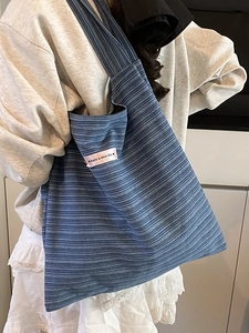 Blue striped knitted tote bag with 'have a nice day' label for women casual use