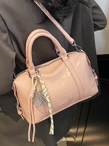 Pink glossy faux leather Boston handbag with GOB FISHIN LING embossing and sport charm