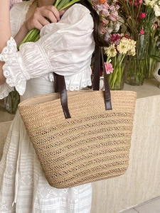 French style straw woven tote bag with brown leather handles for summer beach vacations