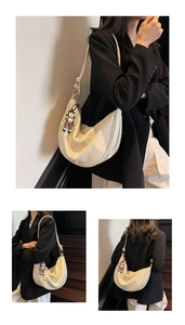 Close-up of beige moon-shaped tote with lychee texture and cute mascot charm