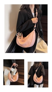 Detail of soft leather crescent hobo bag with unique knot strap and pearl charm