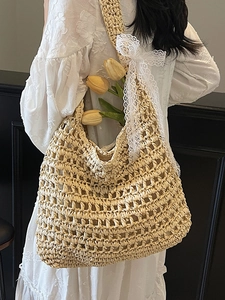 Bohemian beige hollow woven straw tote bag with elegant lace bow for summer beach vacations