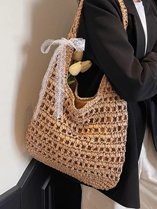 Artistic hollow straw woven tote bag with white lace bow and large capacity for summer vacation