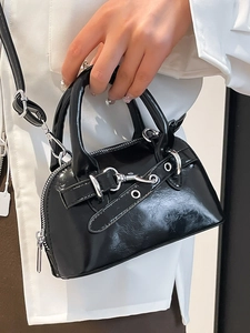 Minimalist black glossy shell bag with silver hardware and chic straps for women