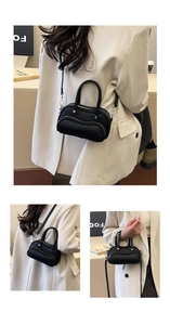 Detail view of black lychee grain bowling bag featuring unique wave zipper design and strap