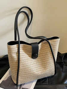 Minimalist beige woven tote bag with black leather trim and large capacity for women