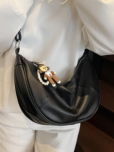 Minimalist black pebble leather crescent hobo bag with pearl chain and cartoon pendant