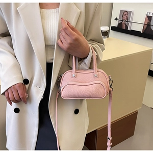 Pink lychee texture bowling bag with silver hardware and detachable crossbody strap