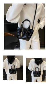 Detailansichten einer schwarzen Handtasche aus Wachsleder mit Glanzeffekt und Silberschnalle
