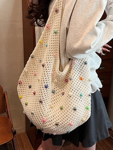 Cream knit shoulder bag with colorful pearls and hollow crochet for beach vacation
