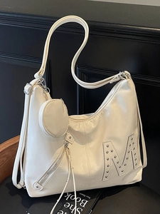 Creamy white biker-style tote bag with silver rivet M-logo and mini round coin pouch