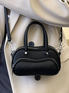 Litchi pattern black bowling bag for women with silver hardware and adjustable strap