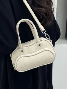 Chic cream lychee pattern leather bowling bag with twin zippers and silver hardware