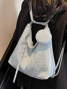 Blue-grey shiny leather hobo tote bag with silver rivets and large letter M design