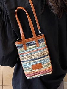 Colorful striped woven straw mini crossbody phone bag with brown leather trim and strap