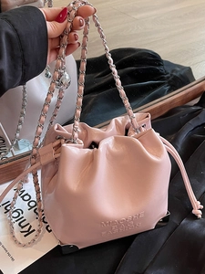 Pink drawstring bucket bag in glossy leather with silver chain strap and metal corners