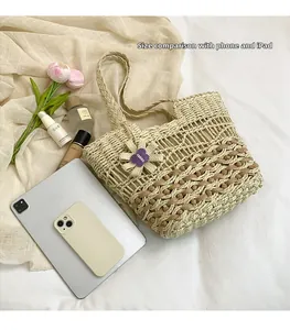 Detail view of woven straw beach bag next to iPad and iPhone for size comparison