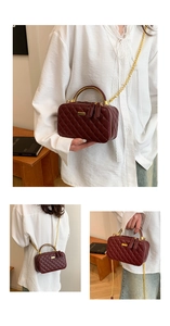 Three-way view of a burgundy quilted box bag with gold metal handle and chain strap
