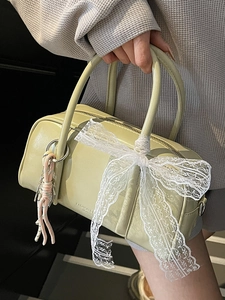 Fashionable light green barrel handbag with lace bow and woven charm for women