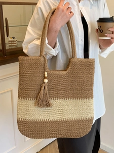 Large woven tote bag with contrast stitching and wooden bead tassel for summer beach vacations