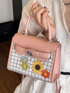 Pink and white square handbag with knitted sunflower decor and adjustable crossbody strap