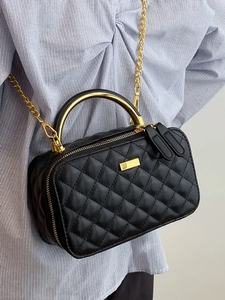 Classic black quilted crossbody bag with golden metal handle and chain strap for women