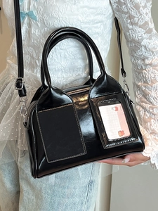 Chic black glossy patent leather Boston bag with handles and adjustable shoulder strap