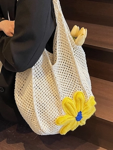 Minimalist cream woven tote bag with large 3D yellow flower detail for summer vacation