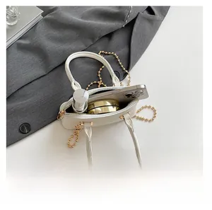 Macro view of white litchi pattern shell bag showing internal space and zipper detail