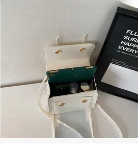 Internal view of beige PU leather square bag showing large capacity for tablet and phone