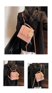 Detail of pink PU leather backpack with teddy bear charm and elegant metal buckle