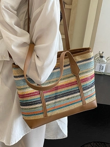 Rainbow striped woven tote bag with brown leather handles for summer travel and commuting