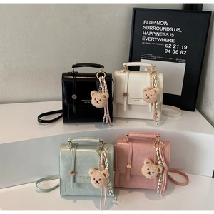 Miniature backpack collection in four pastel colors with cute bear charms and silk scarves