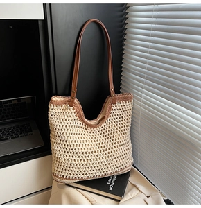 Close-up of woven tote bag texture with cream crochet pattern and leather handles