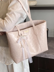 Light pink tote bag with embossed puppy pattern and elegant pearl lace charm