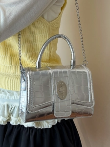 Silver metallic crocodile pattern small handbag with metal chain strap and turn-lock
