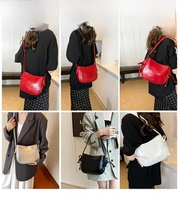 Collage di eleganti borse a secchiello in pelle cerata in rosso, argento, nero e bianco