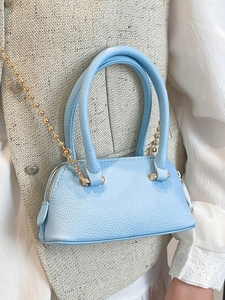 Minimalist light blue shell bag in lychee texture leather with gold chain strap