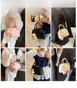 Detailed views of the stylish bowling bag shown with handles and detachable shoulder strap