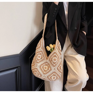 Detail of handmade crochet tote bag featuring vintage geometric floral patterns