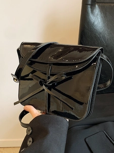 Glossy black oil wax leather crossbody bag with a delicate bow knot for women
