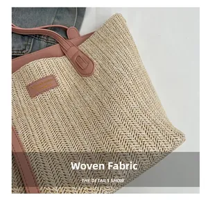 Close-up detail of woven tote bag texture with pink leather trim and brand logo patch