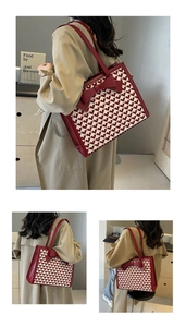 Detail view of the red heart pattern tote bag with bow accent and slim shoulder straps