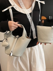 Minimalist litchi grain bucket bag with metal lock and chain strap for women