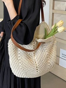 Chic beige woven tote bag with brown leather straps for casual beach vacation use