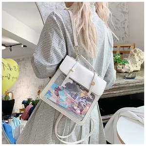 Detail view of the cream leather ita bag featuring transparent window and magnetic closure