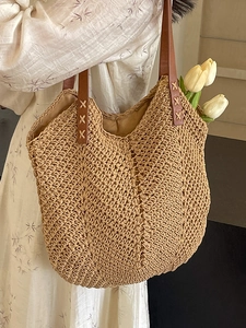 Bohemian large straw woven tote bag with brown leather straps and V-shaped texture