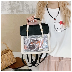 Detail of transparent PVC window on a contrast PU leather backpack for anime card display